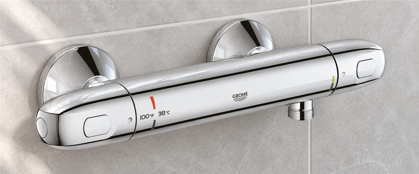 GROHE Grohtherm 1000 exposed thermostatic shower bar valve in chrome, showing the 100F / 38C SafeStop marking