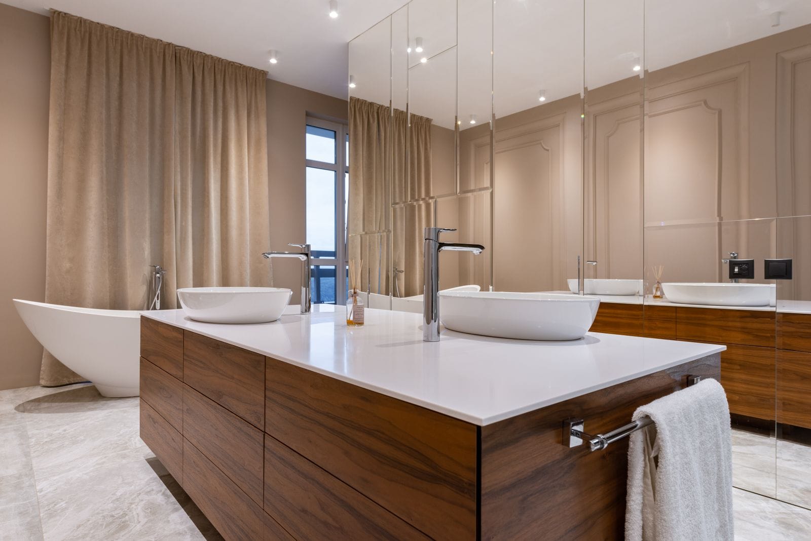 High-end bathroom with a double vanity and freestanding tub