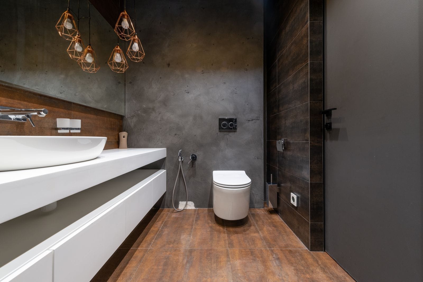 Wall-hung toilet with a concealed carrier in a modern bathroom